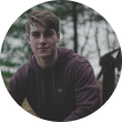 short haired guy with dark purple sweatshirt